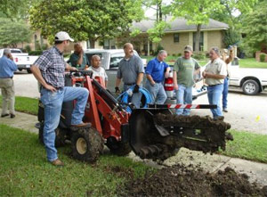 our League City irrigation repair team is using a professional trencher