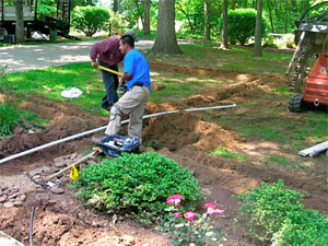 two of our techs are arranging the pipes in trenches