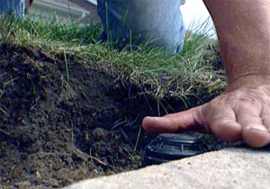 a tech is cleaning a sprinkler head