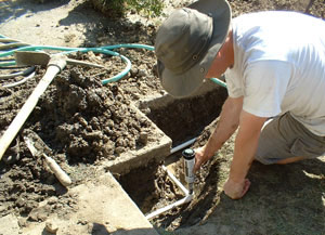 a tech is adding a new sprinkler head